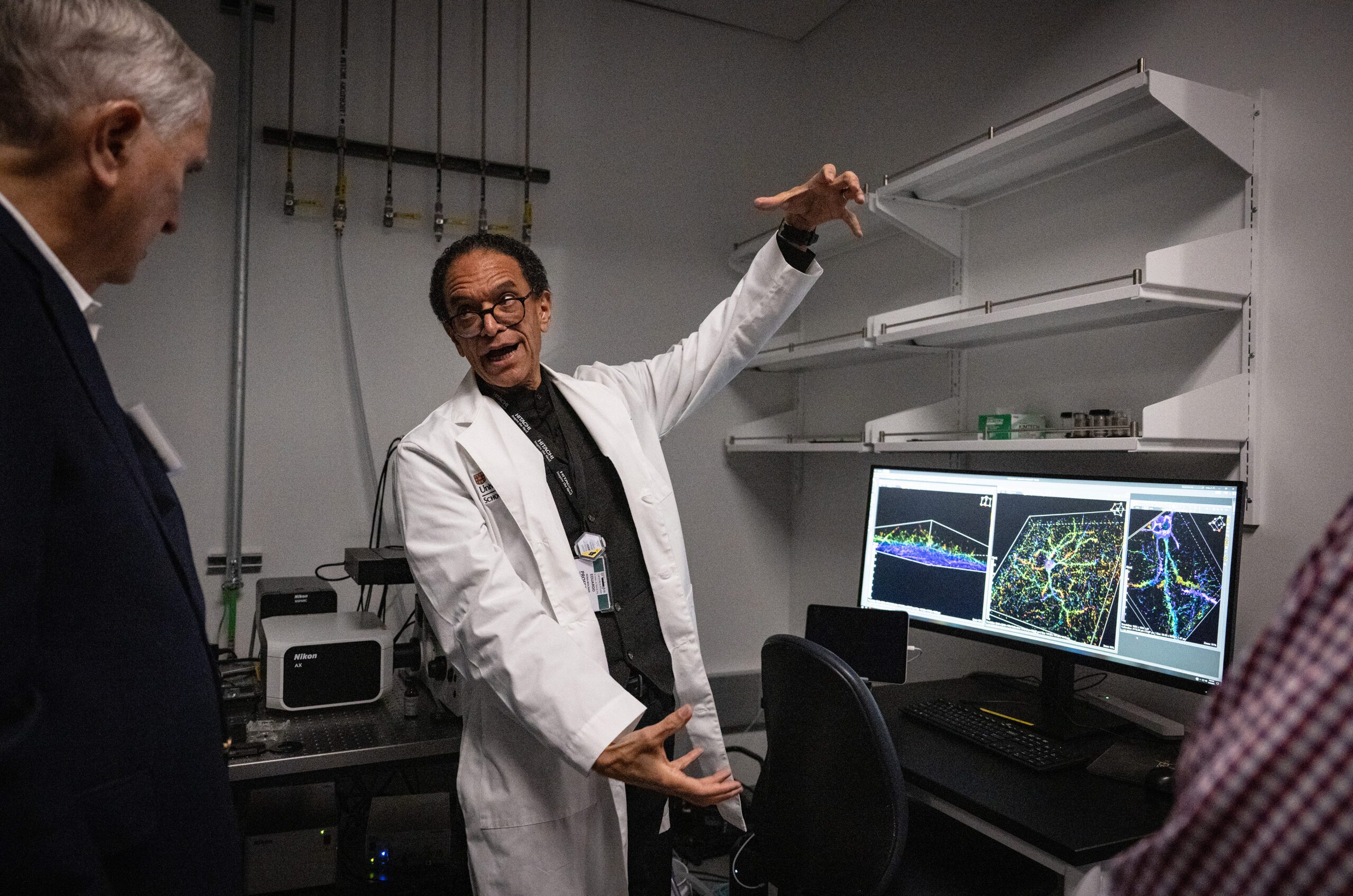 Physician Scientist explaining new neuroscience research to help victims of stroke. Imagine a world...Where the brain heals itself.