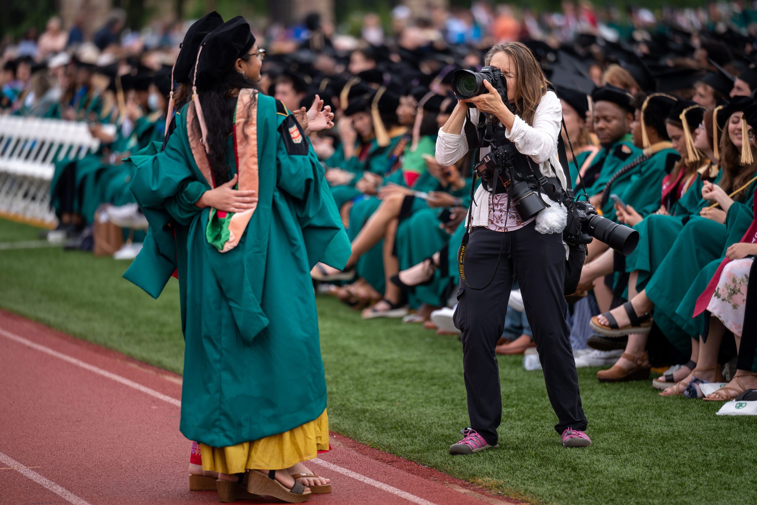 Carol Green photographing WashU Commencement